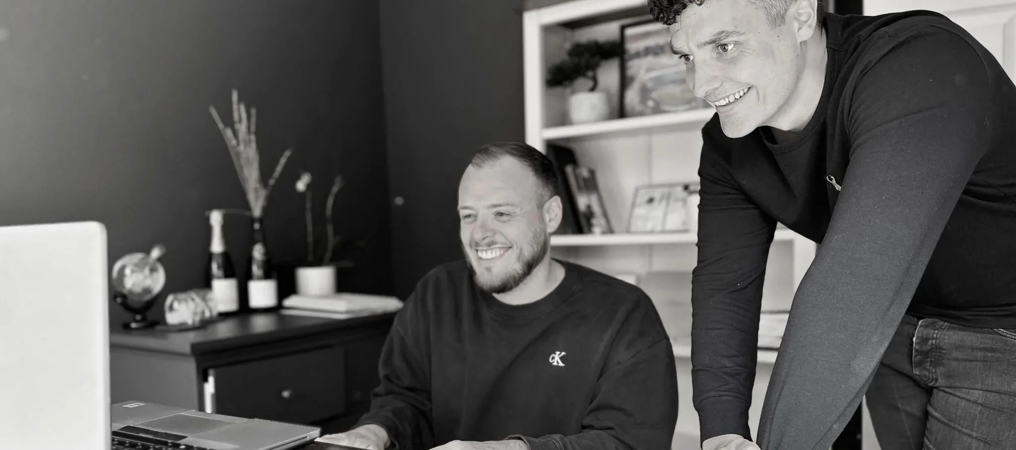 two employees working at computer